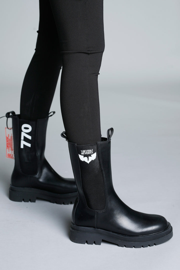 Black high cut faux leather boots | Runway Secrets